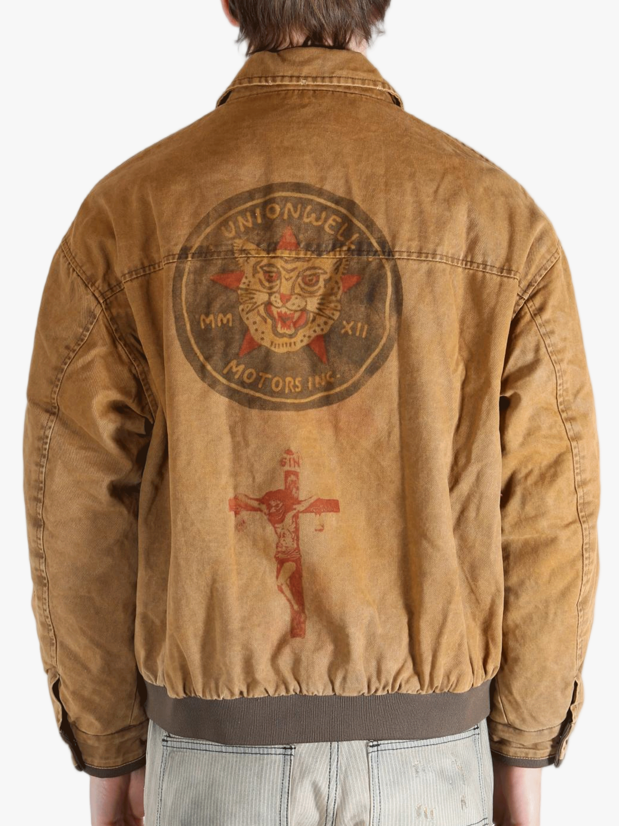 Brown jacket worn by a person, showing the jacket's fit