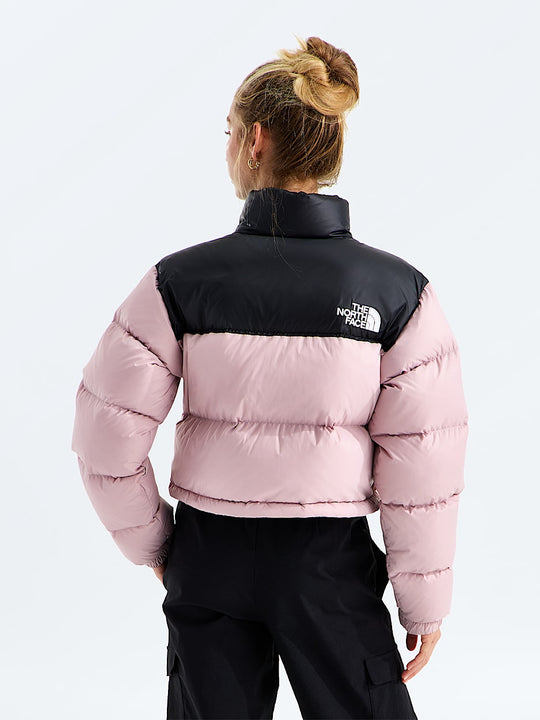 Pink jacket worn by a person, showing the jacket fit