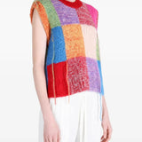 Red knitwear worn by a person, showing the knitwear fit