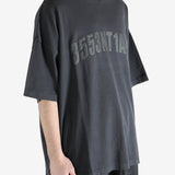 Black t-shirt worn by a person, showing the shirt's fit