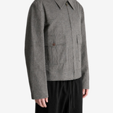 Grey jacket worn by a person, showing the jacket fit