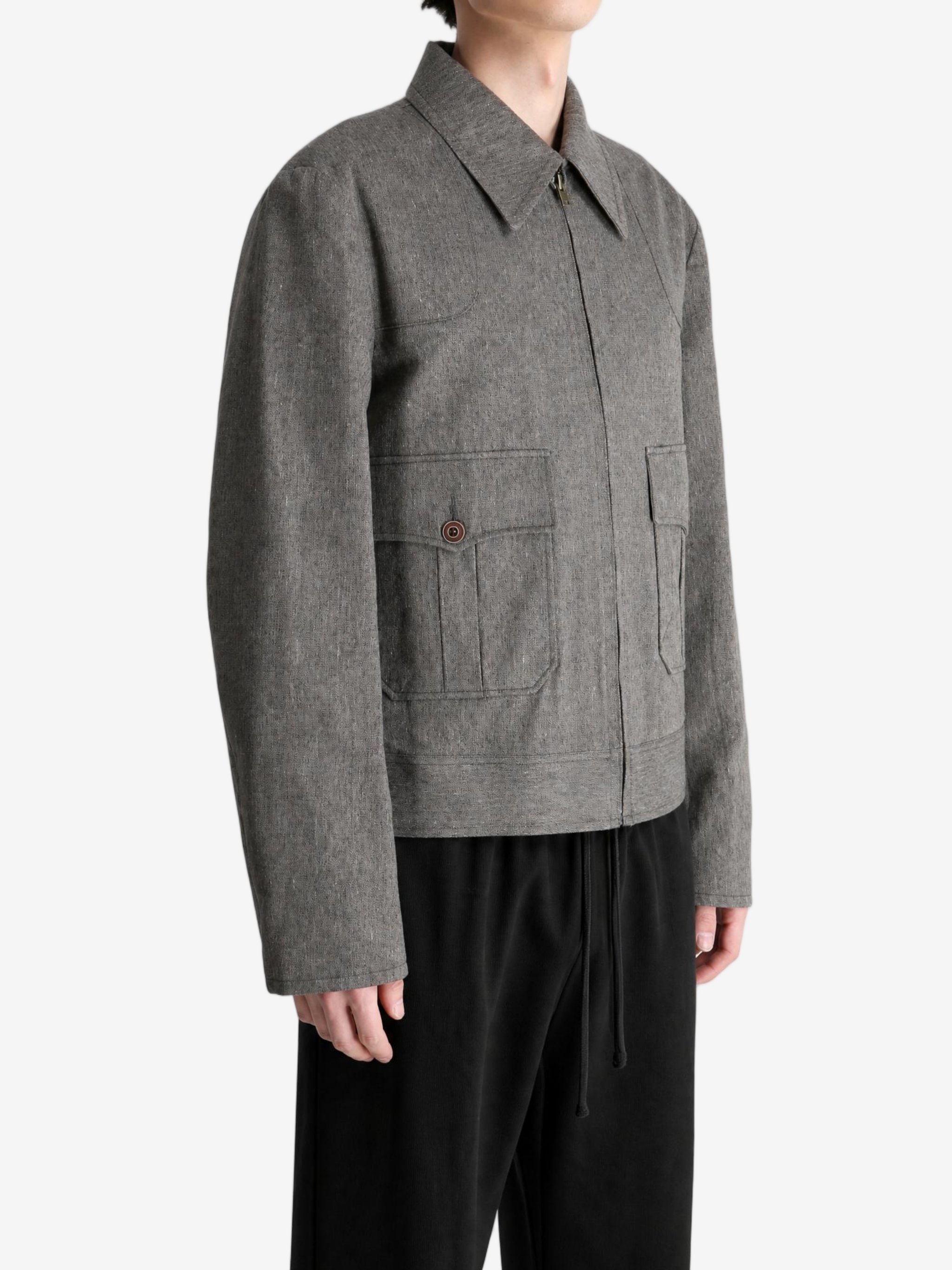 Grey jacket worn by a person, showing the jacket fit