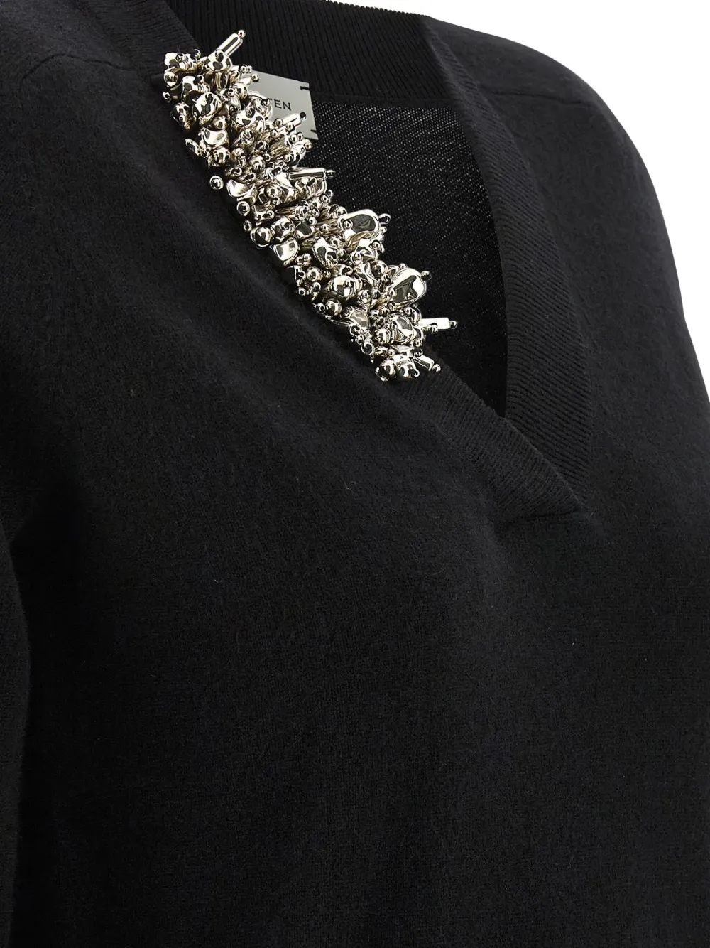Close up of black sweater, showing texture of the cashmere fabric
