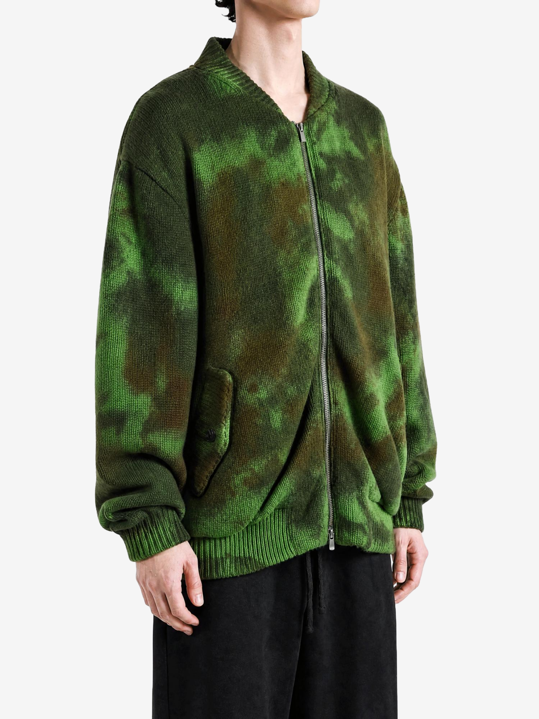 Green jacket worn by a person, showing the jacket fit