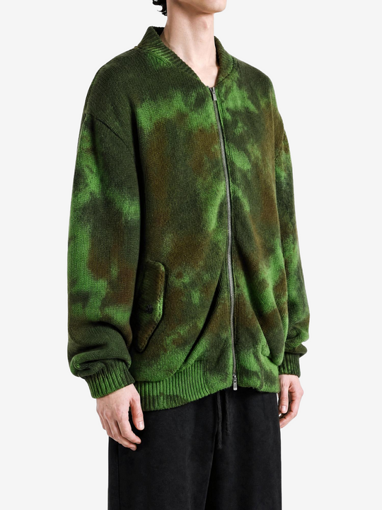 Green jacket worn by a person, showing the jacket fit