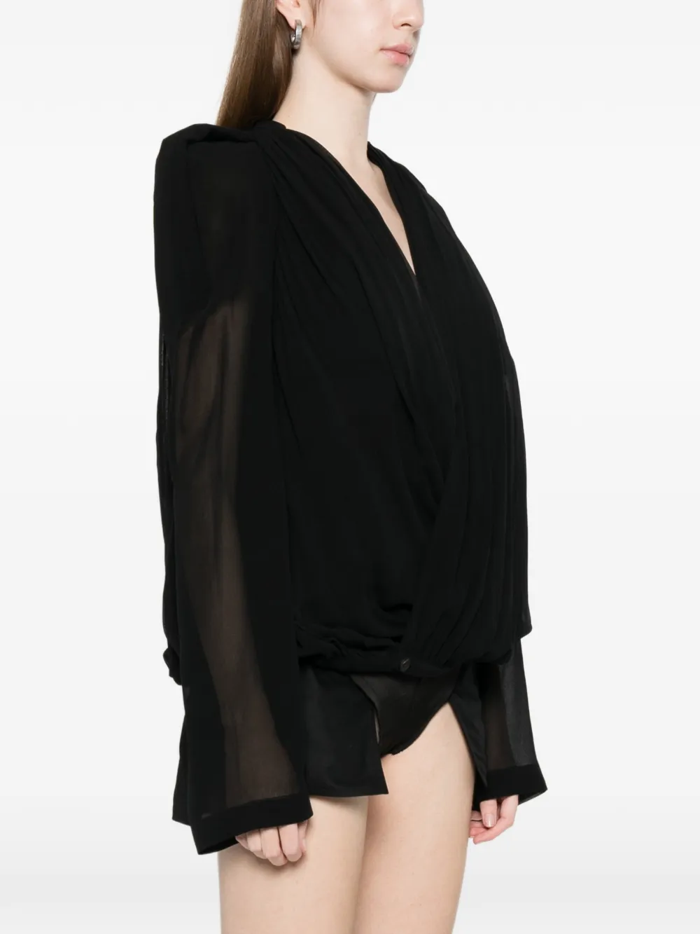 Black jacket worn by a person, showing the jacket fit