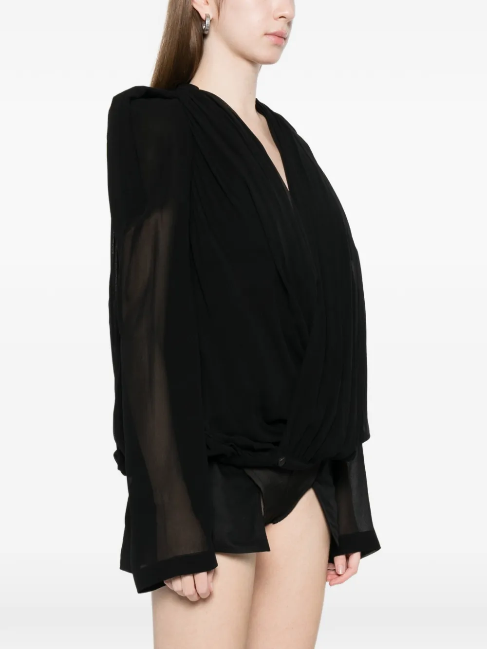 Black jacket worn by a person, showing the jacket fit