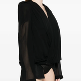 Black jacket worn by a person, showing the jacket fit