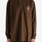 Brown shirt worn by a person, showing the shirt's fit