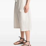 White short worn by a person, showing the short's fit