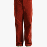 Red pants worn by a person, showing the pants fit