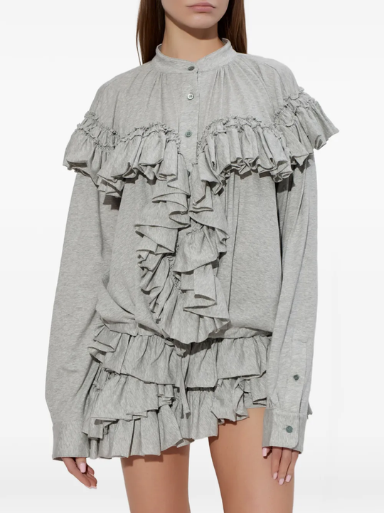 Grey top worn by a person, showing the top fit