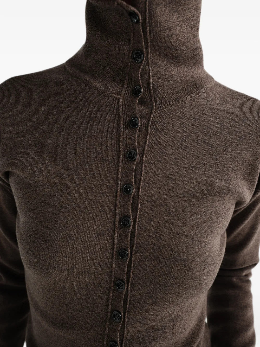 Brown top worn by a person, showing the top fit