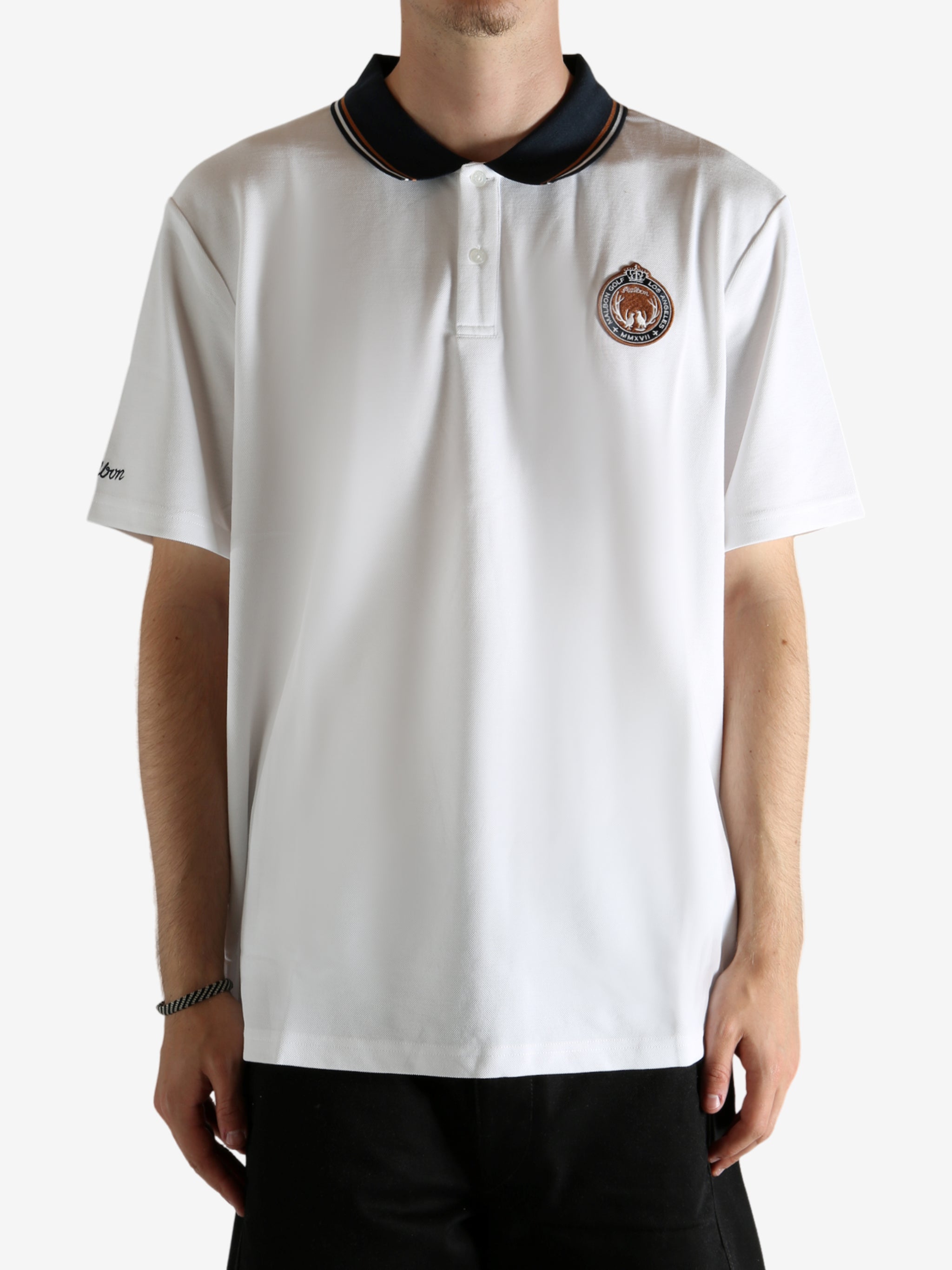 White shirt worn by a person, showing the shirt's fit