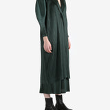 Green coat worn by a person, showing the coat's fit