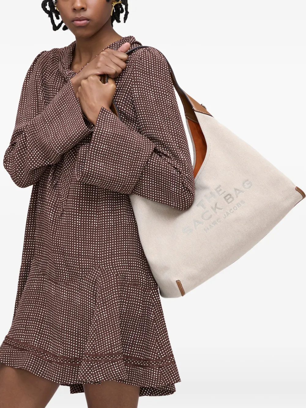 Tan bag worn by a person, showing the bags fit