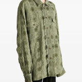 Green top worn by a person, showing the top fit