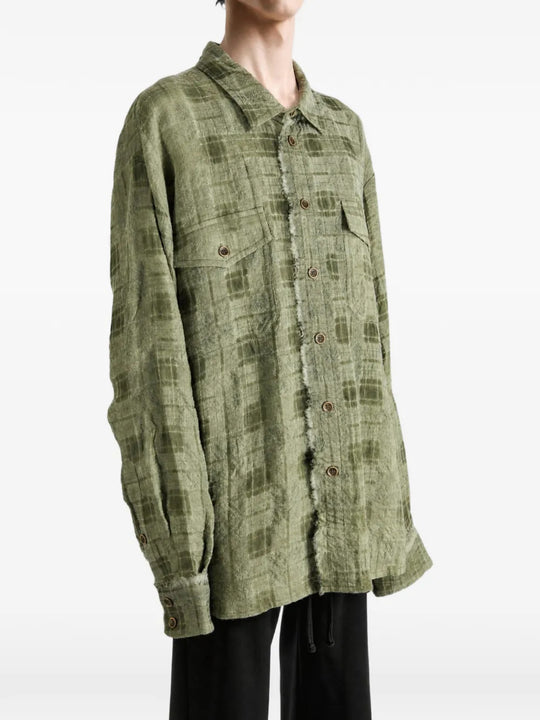 Green top worn by a person, showing the top fit
