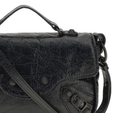 Close up of black bags , showing texture of the lamb skin fabric