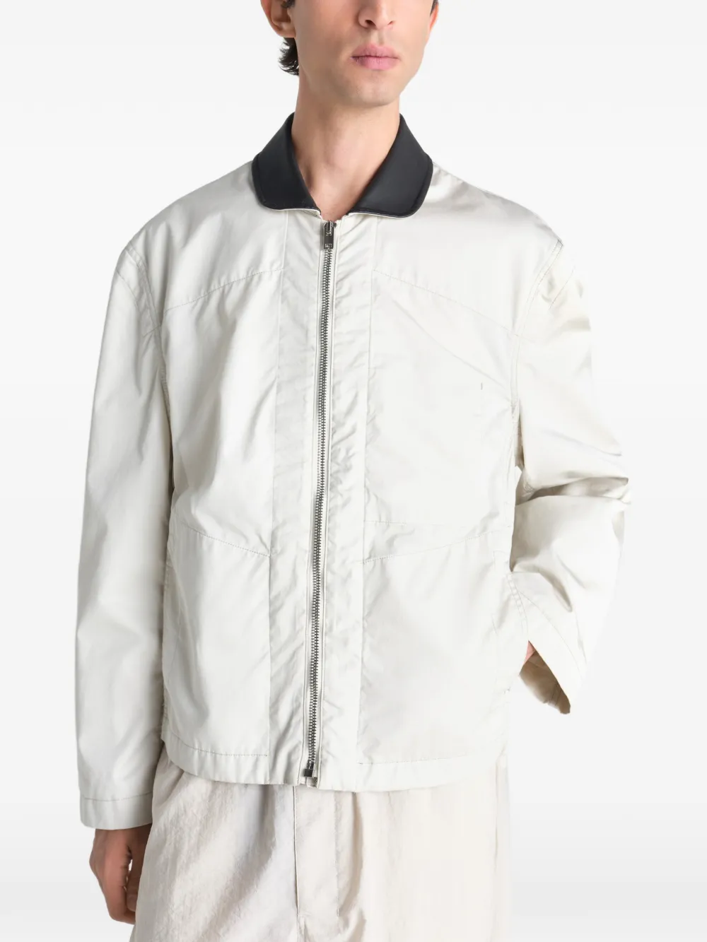 Tan jacket worn by a person, showing the jacket fit