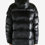 Black coat worn by a person, showing the coat's fit