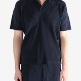 Navy shirt worn by a person, showing the shirt's fit