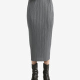 Grey skirts worn by a person, showing the skirts fit