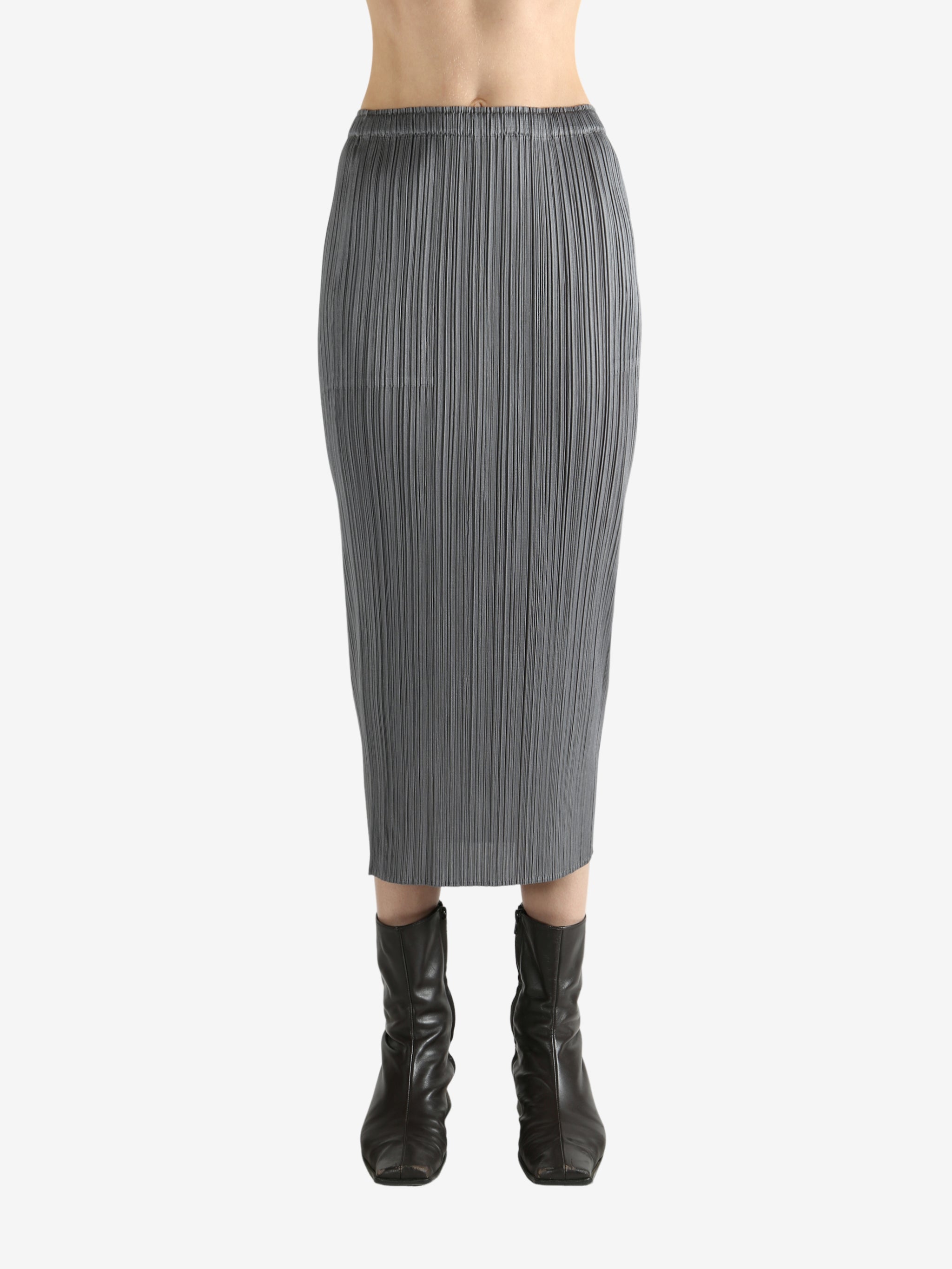 Grey skirts worn by a person, showing the skirts fit