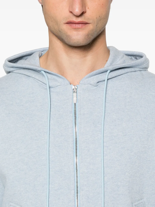Close up of the blue hoodie, showing texture of the cotton fabric