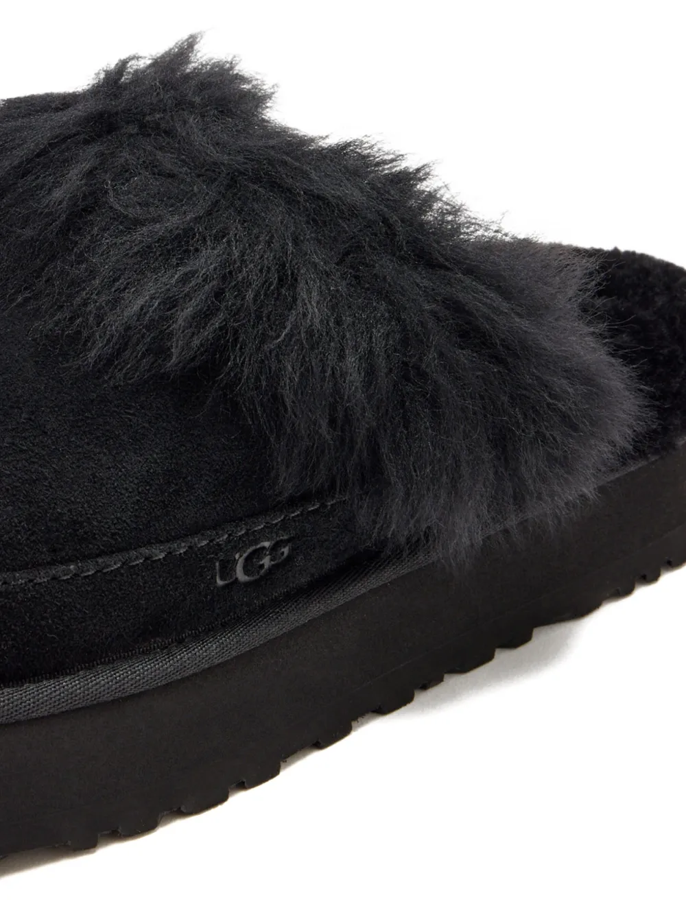 Close up of black boots, showing texture of the Suede fabric