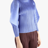 Blue shirt worn by a person, showing the shirt fit