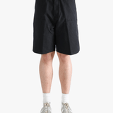 Black shorts worn by a person, showing the shorts fit