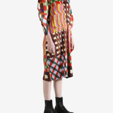 Pink coat worn by a person, showing the coat fit