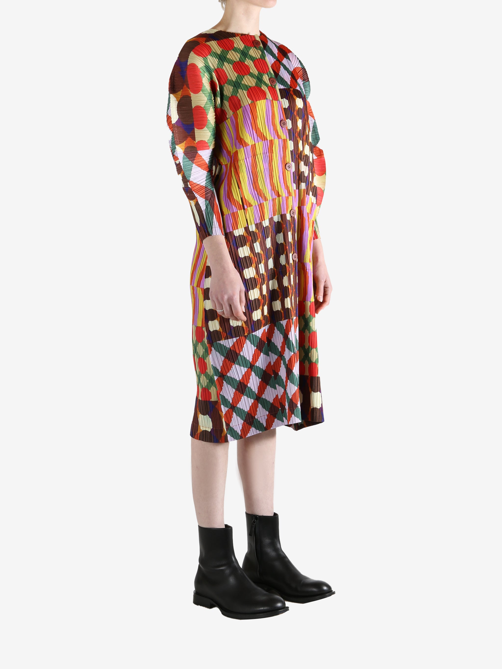 Pink coat worn by a person, showing the coat fit