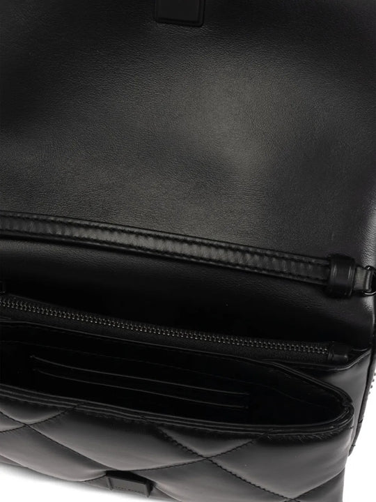 Close up of black bags, showing texture of the calf leather fabric