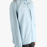 Blue jacket worn by a person, showing the jacket's fit