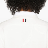 Close up of white knitwear, showing texture of the cotton fabric