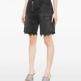 Black short worn by a person, showing the short's fit