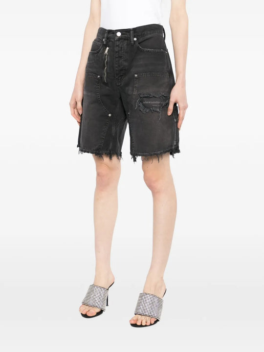 Black short worn by a person, showing the short's fit