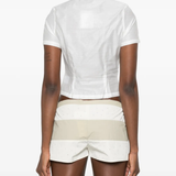 White tops worn by a person, showing the white tops' fit