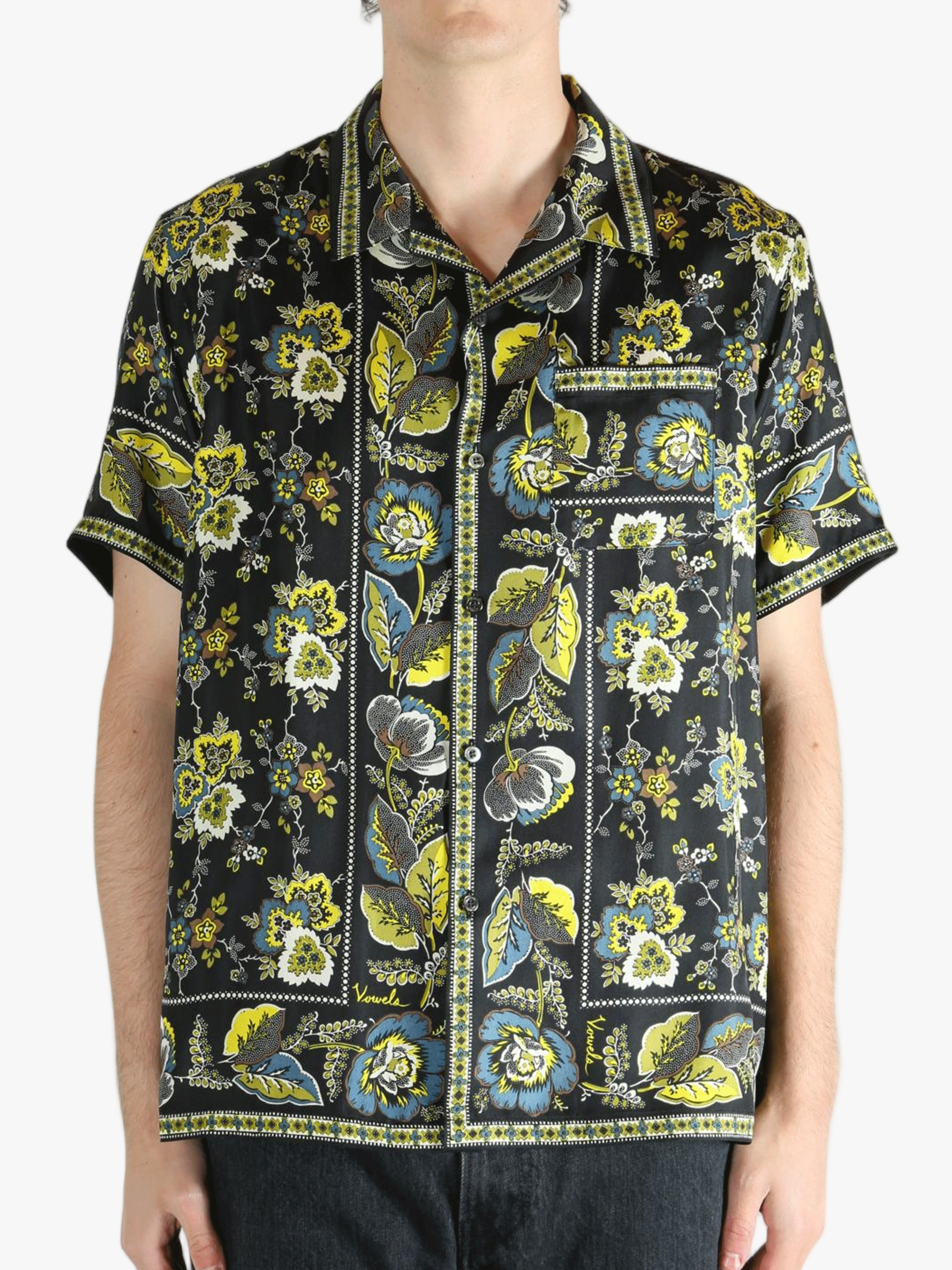 Black shirt worn by a person, showing the shirt's fit