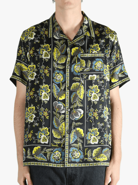 Black shirt worn by a person, showing the shirt's fit