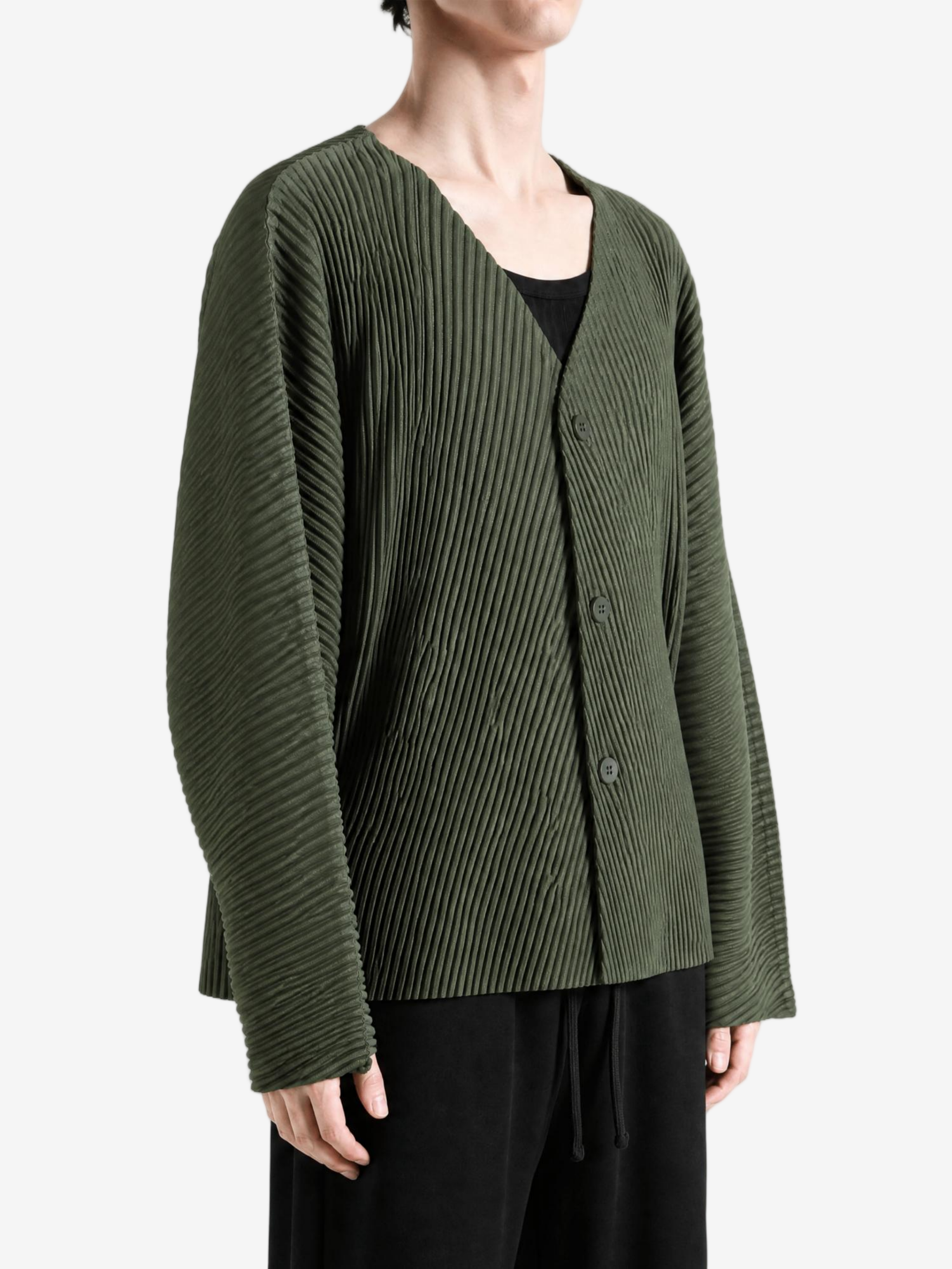Green jacket worn by a person, showing the jacket fit