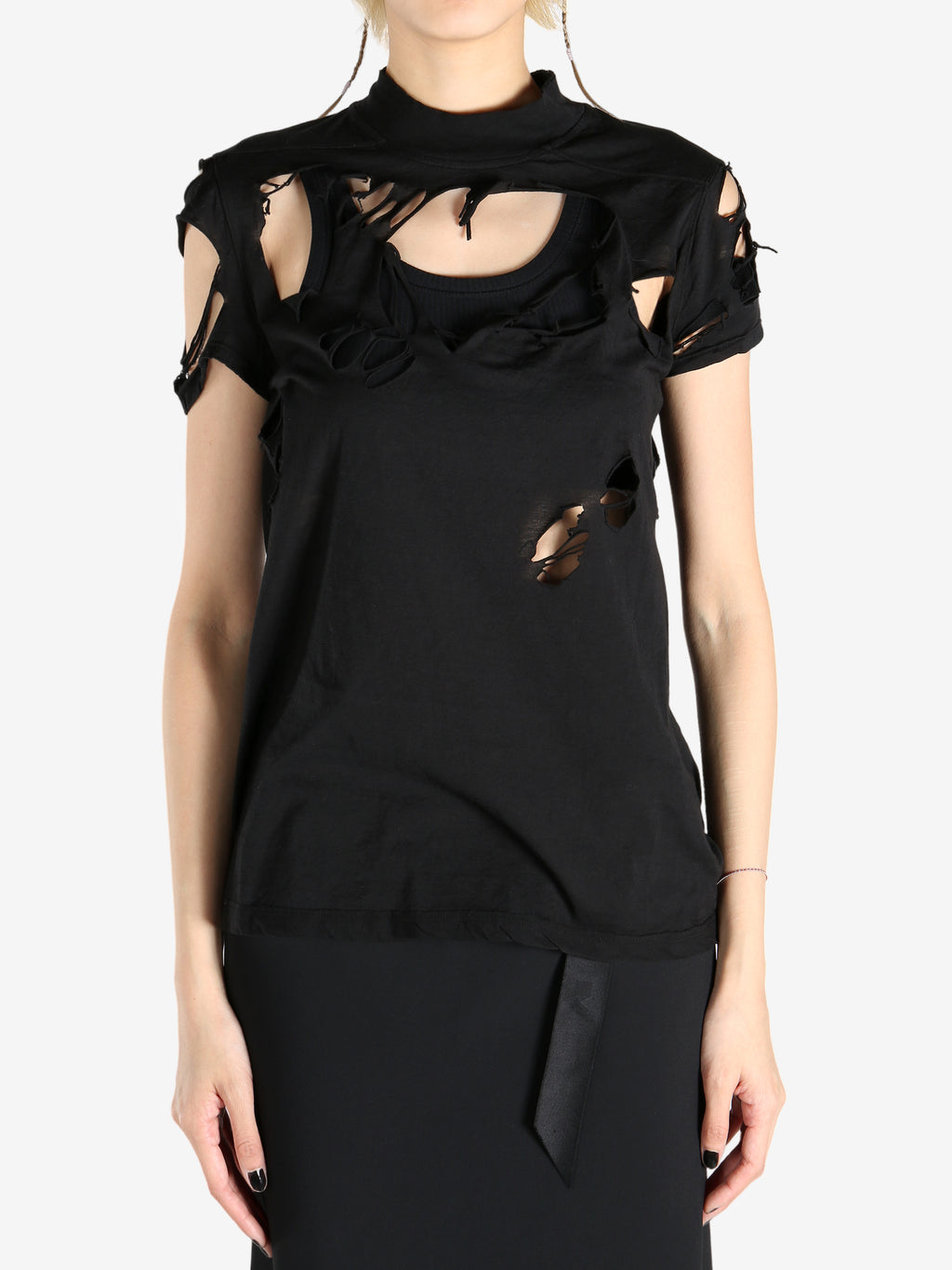 Black tops worn by a person, showing the tops fit
