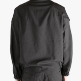 Black jackets-coats worn by a person, showing the jackets-coats's fit