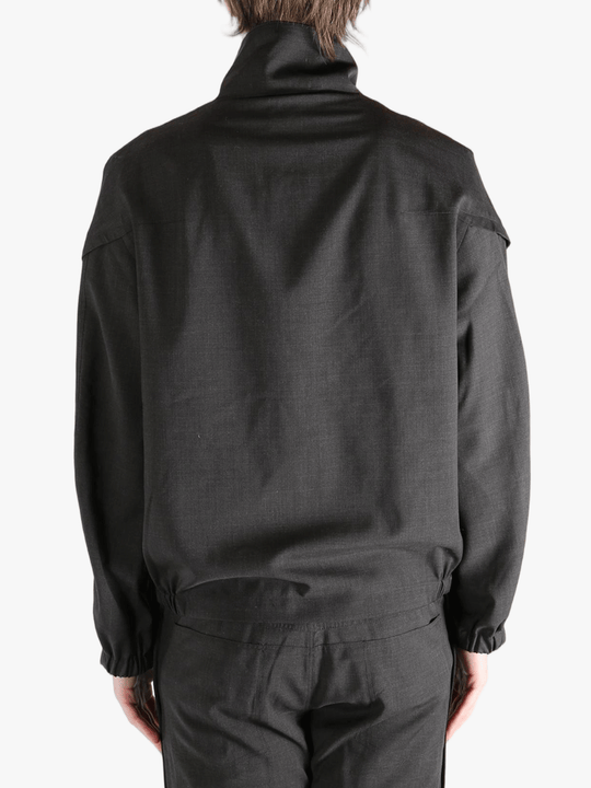 Black jackets-coats worn by a person, showing the jackets-coats's fit