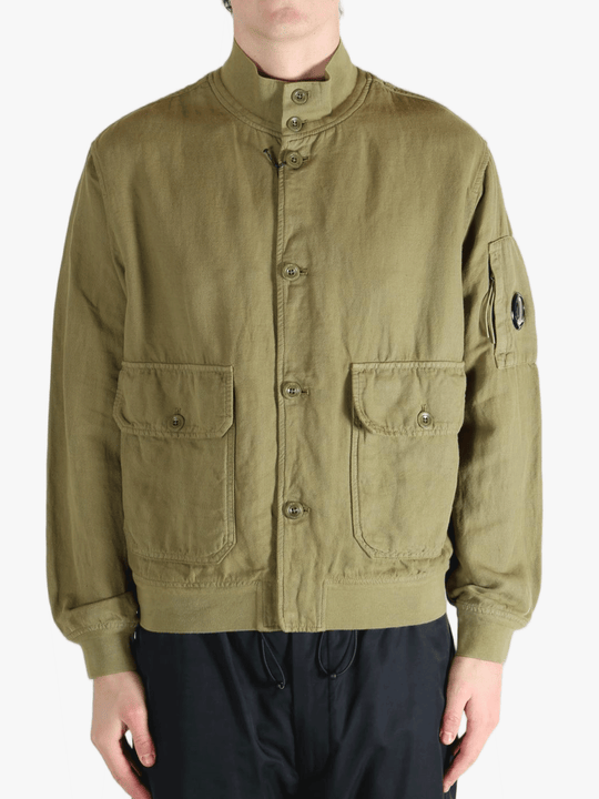 Green jacket worn by a person, showing the jacket's fit