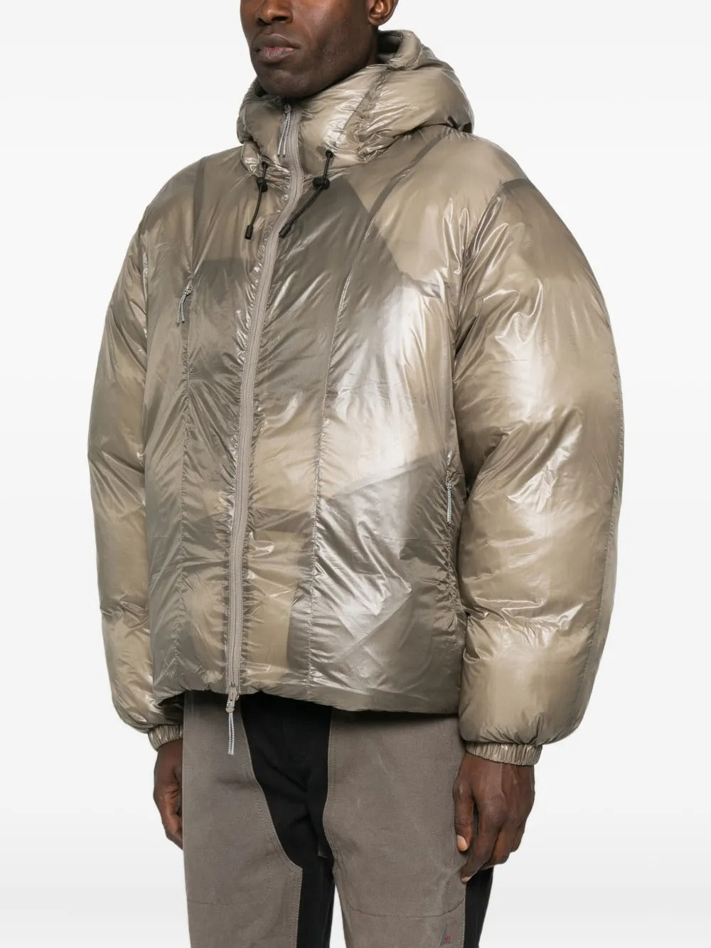 Tan jackets worn by a person, showing the jackets fit