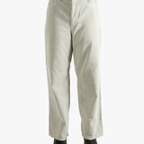 White pants worn by a person, showing the pants' fit