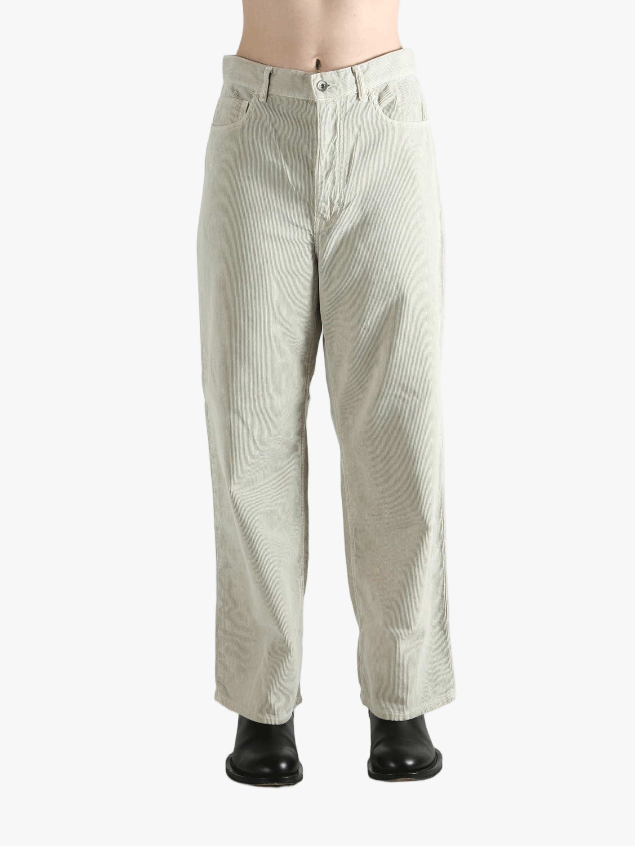 White pants worn by a person, showing the pants' fit